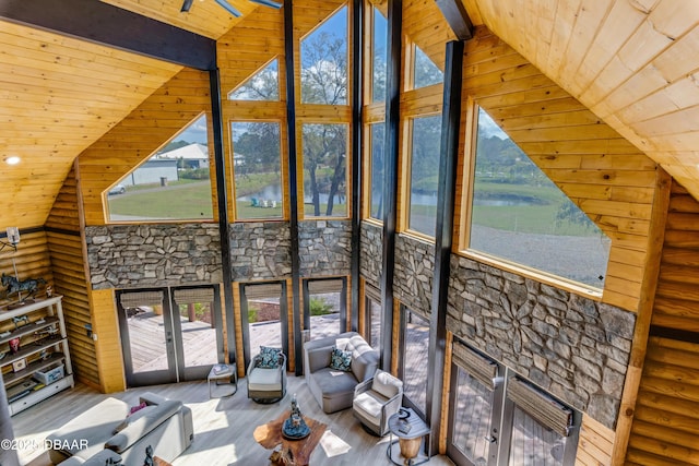 unfurnished sunroom with vaulted ceiling with beams and wooden ceiling