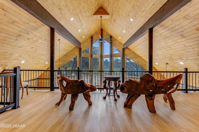 sitting room with wooden ceiling, floor to ceiling windows, beam ceiling, and wood finished floors