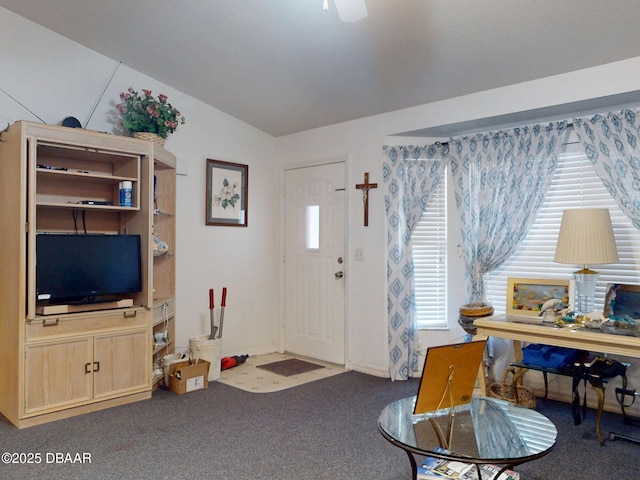 entrance foyer with lofted ceiling and carpet