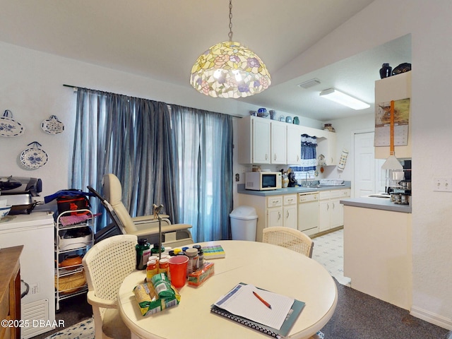 dining room featuring lofted ceiling