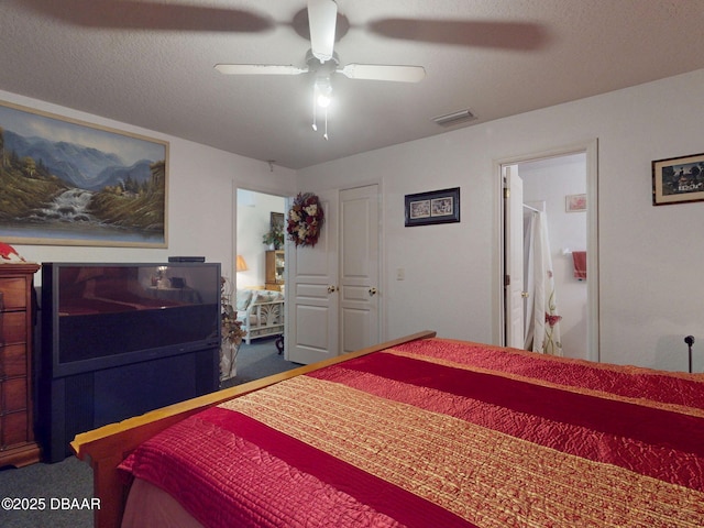carpeted bedroom with ceiling fan and visible vents