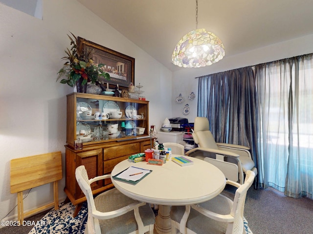 dining area featuring lofted ceiling