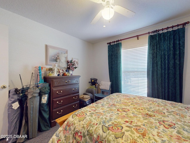 bedroom featuring ceiling fan and carpet floors