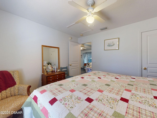 bedroom featuring ceiling fan and visible vents