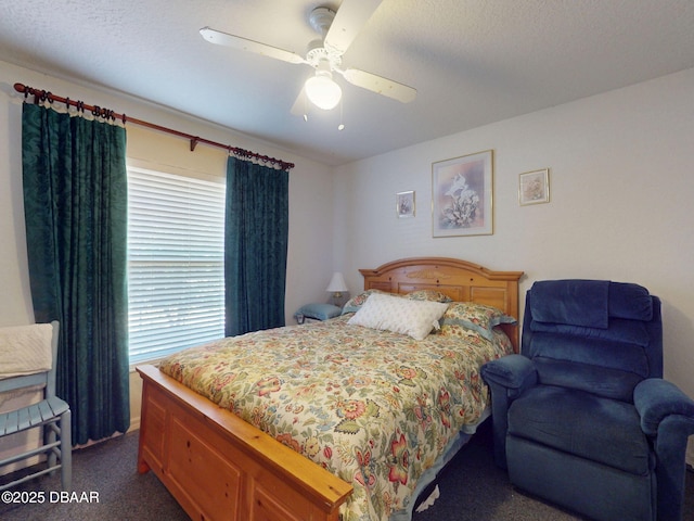bedroom with ceiling fan, baseboards, and dark carpet