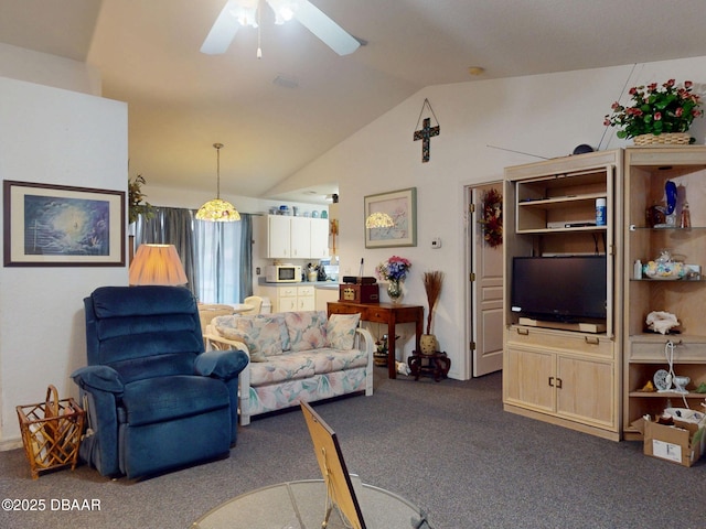 living area with carpet flooring, lofted ceiling, and ceiling fan