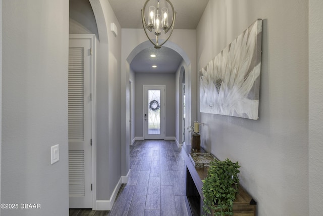 doorway with dark hardwood / wood-style flooring