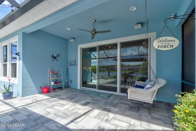 view of patio / terrace featuring ceiling fan