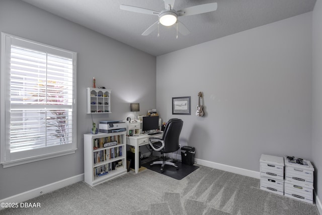 office space featuring ceiling fan and carpet floors