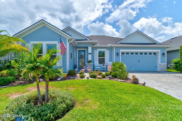 view of front of property featuring a garage and a front lawn