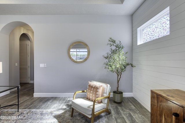 sitting room featuring dark wood-type flooring