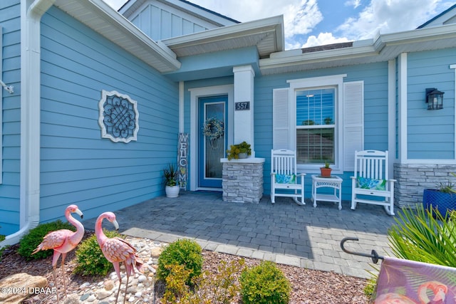 property entrance featuring covered porch