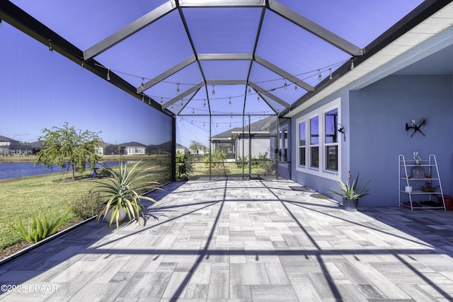 view of patio / terrace featuring glass enclosure