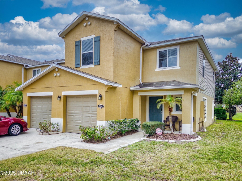 front facade featuring a front lawn and a garage