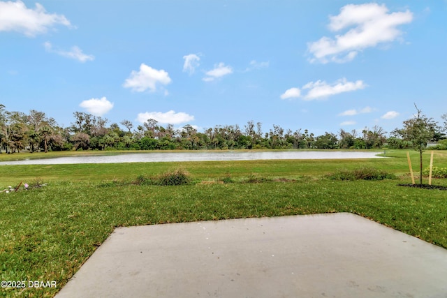 exterior space featuring a water view and a patio