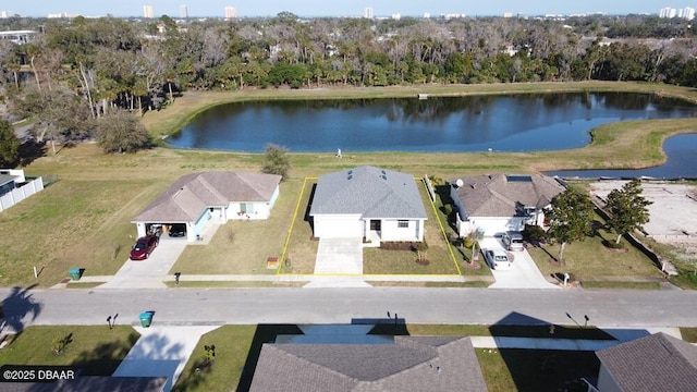 birds eye view of property with a water view