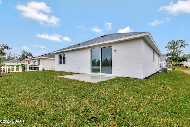 back of property featuring a patio, a yard, stucco siding, central air condition unit, and fence