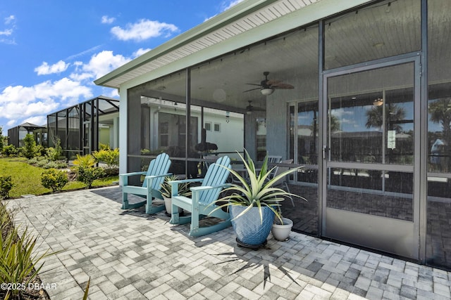 view of patio featuring a sunroom, a lanai, and ceiling fan