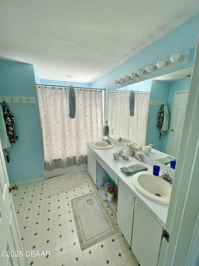 6037 Hickory Grove Ln, Port Orange, FL 32128 - bathroom with double vanity, tile patterned floors, a textured ceiling, and a shower with shower curtain
