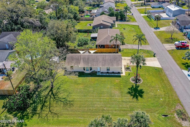 birds eye view of property with a residential view