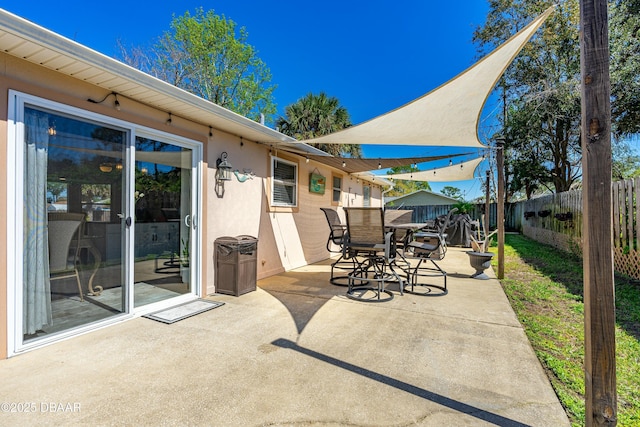 view of patio / terrace with a fenced backyard and outdoor dining area