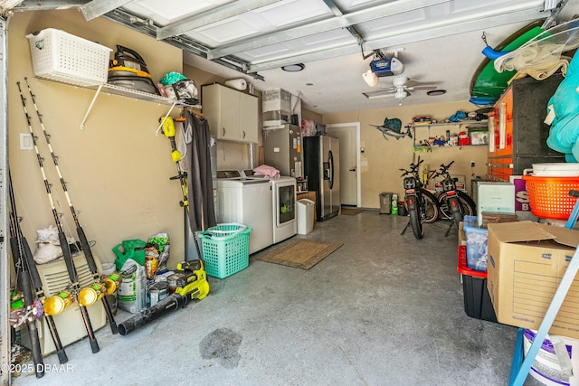 garage featuring stainless steel fridge, separate washer and dryer, and a garage door opener