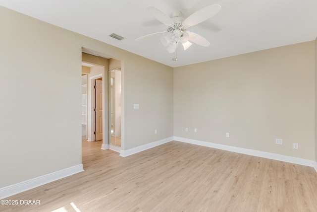 empty room with ceiling fan and light wood-type flooring