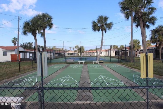 view of property's community with tennis court