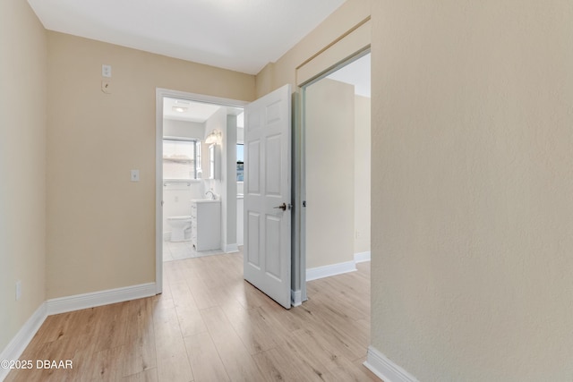 hall with light hardwood / wood-style floors