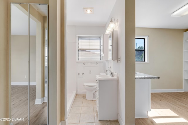 bathroom featuring hardwood / wood-style flooring, vanity, and toilet