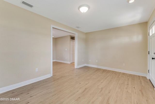 spare room featuring light hardwood / wood-style flooring