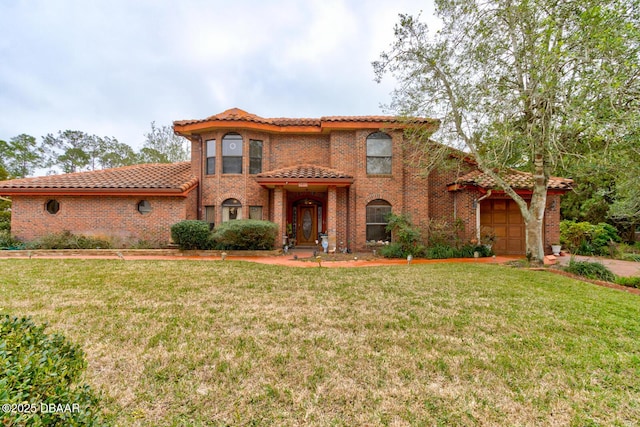 mediterranean / spanish-style house with a garage and a front lawn