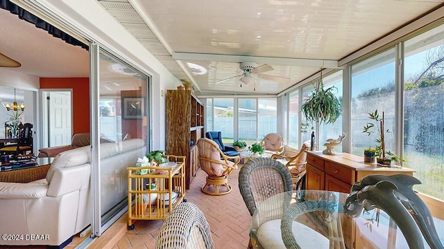24 Seabridge Dr, Ormond Beach, FL 32176 - sunroom with ceiling fan, brick floors, and outdoor dining area