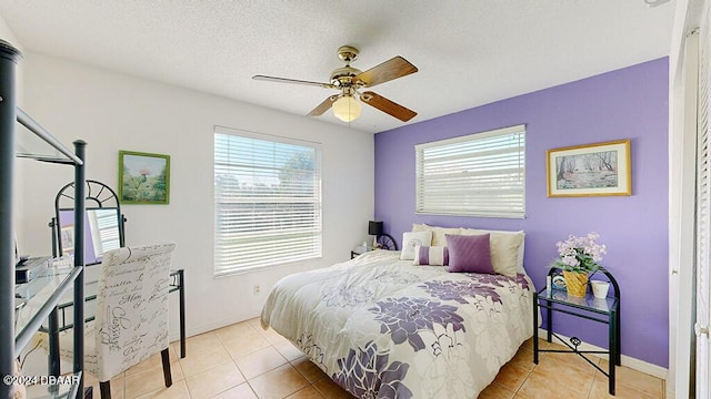 24 Seabridge Dr, Ormond Beach, FL 32176 - tiled bedroom featuring baseboards and a ceiling fan