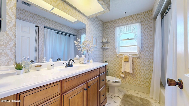 full bathroom featuring toilet, vanity, tile patterned floors, and shower / bathtub combination with curtain