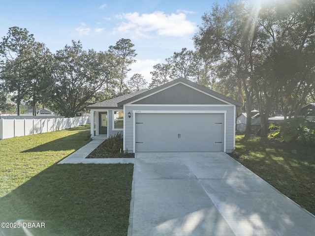 single story home featuring a garage and a front lawn