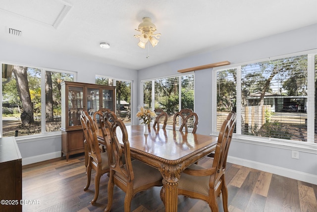 dining space featuring ceiling fan, a healthy amount of sunlight, and hardwood / wood-style flooring