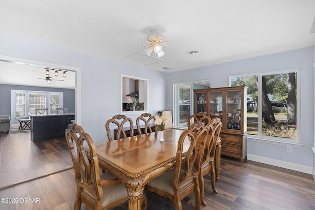 dining area with dark wood-type flooring, ceiling fan, and plenty of natural light