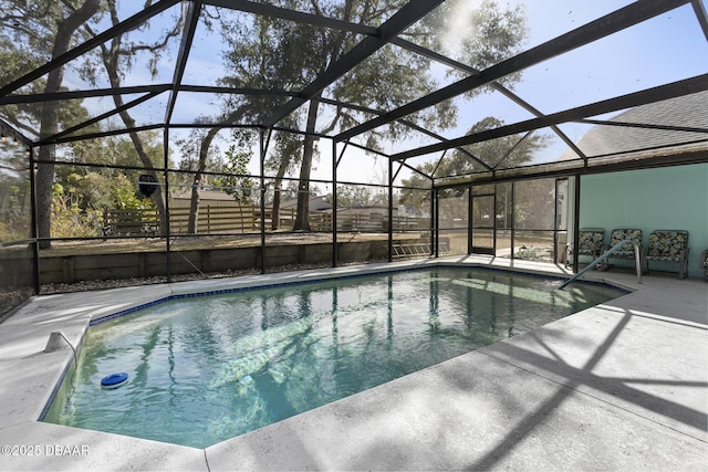 view of swimming pool with a lanai and a patio