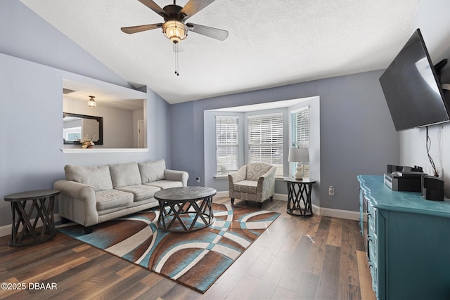 living room featuring ceiling fan, a textured ceiling, dark hardwood / wood-style floors, and lofted ceiling