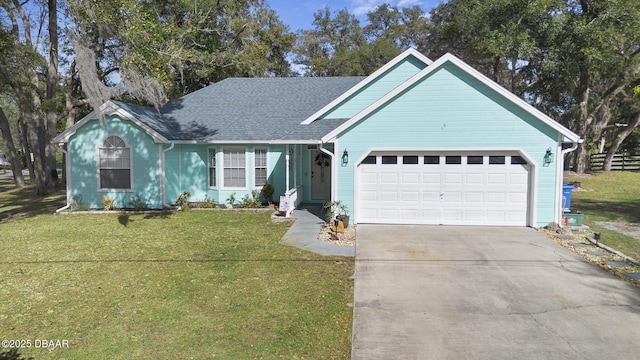 view of front of home featuring a garage and a front lawn