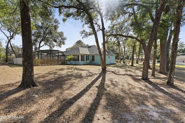 view of yard with a lanai