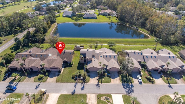 birds eye view of property featuring a water view and a residential view