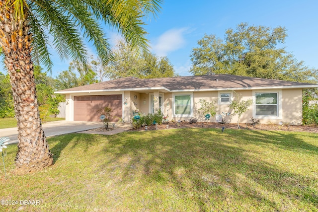 single story home featuring a front lawn and a garage