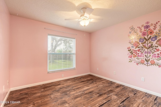 empty room with a textured ceiling, ceiling fan, and dark wood-type flooring