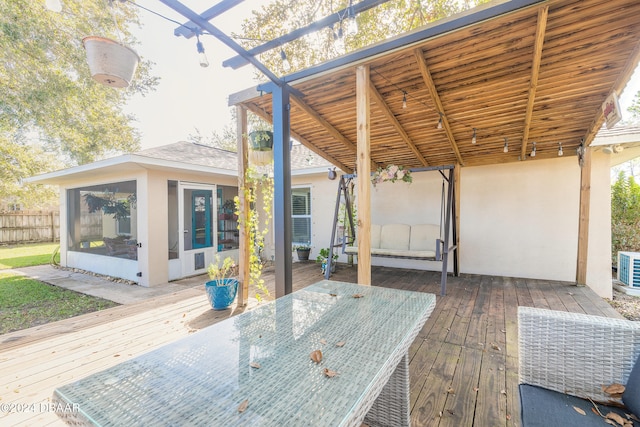 deck with a sunroom