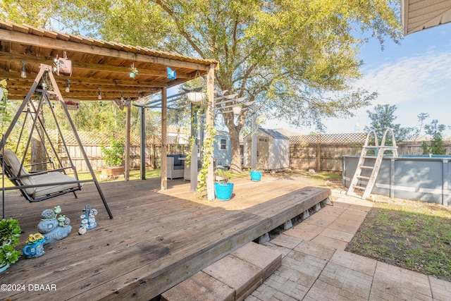 wooden terrace featuring a storage unit