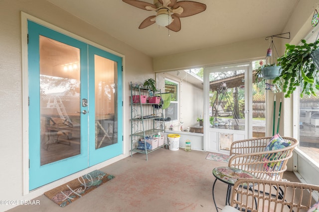 sunroom / solarium featuring ceiling fan and french doors