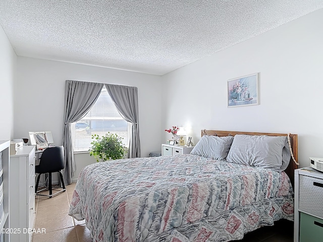 420 Banana Cay Dr Unit A, South Daytona, FL 32119 - bedroom featuring a textured ceiling and light tile patterned floors