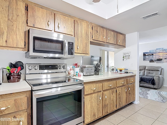 420 Banana Cay Dr Unit A, South Daytona, FL 32119 - kitchen featuring visible vents, light countertops, light tile patterned flooring, and stainless steel appliances